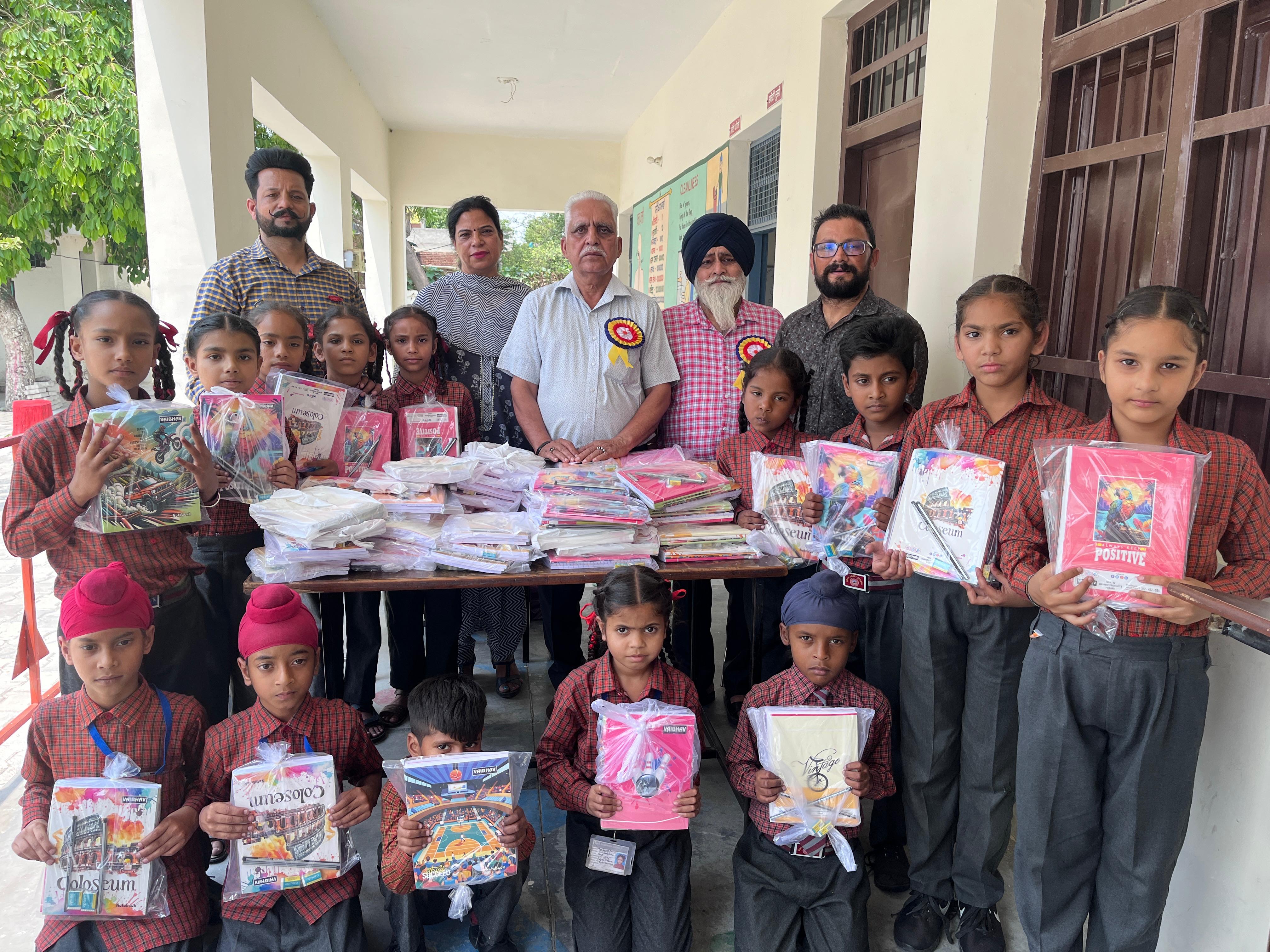 Stationery distributed to students of government school in village Phaggan Majra